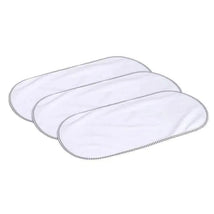 Three rectangular Munchkin waterproof changing pad liners stacked together, featuring a white surface and black edging.