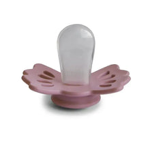 Two silicone pacifiers in cedar and baby pink colors with a symmetrical design, suitable for infants aged 0 to 6 months.