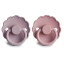 Natural rubber baby pacifiers in baby pink and soft lilac, designed for infants 0 to 6 months.