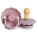 Natural rubber baby pacifiers in baby pink and soft lilac, designed for infants aged 6-18 months.