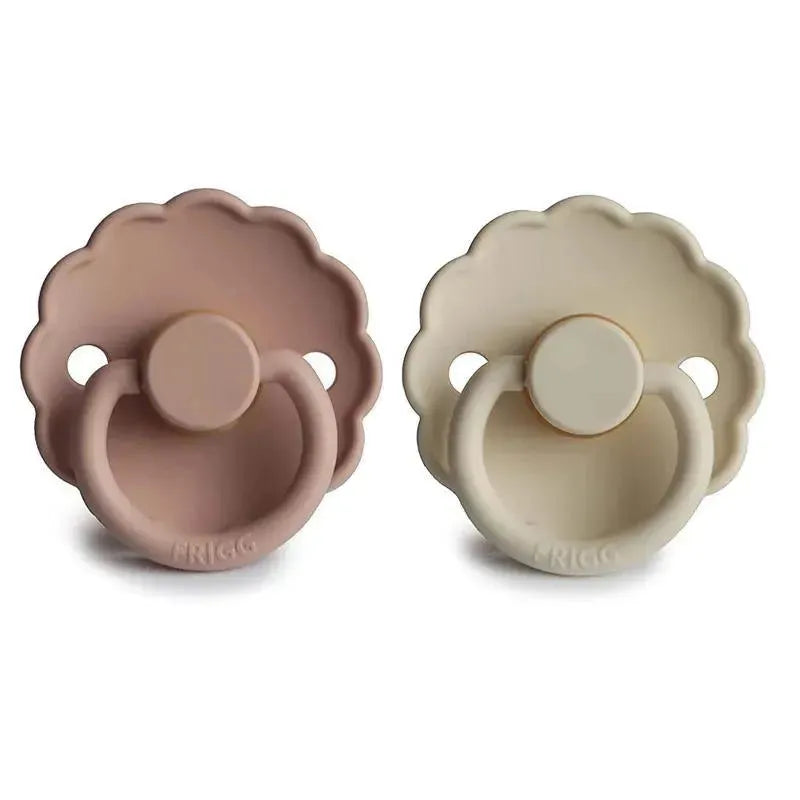 Natural rubber baby pacifiers in blush and cream colors, featuring a daisy-shaped design for infants 0-6 months.