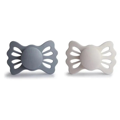 Two symmetrical silicone pacifiers in gray and silver gray, designed for ages 6 to 18 months.