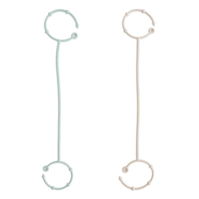Adjustable silicone straps in Cambridge Blue and Shifting Sand, designed for versatile use in various applications.