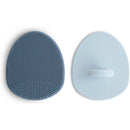 Silicone baby bath cradle cap brush set in Tradewinds and Periwinkle colors with textured and smooth surfaces.