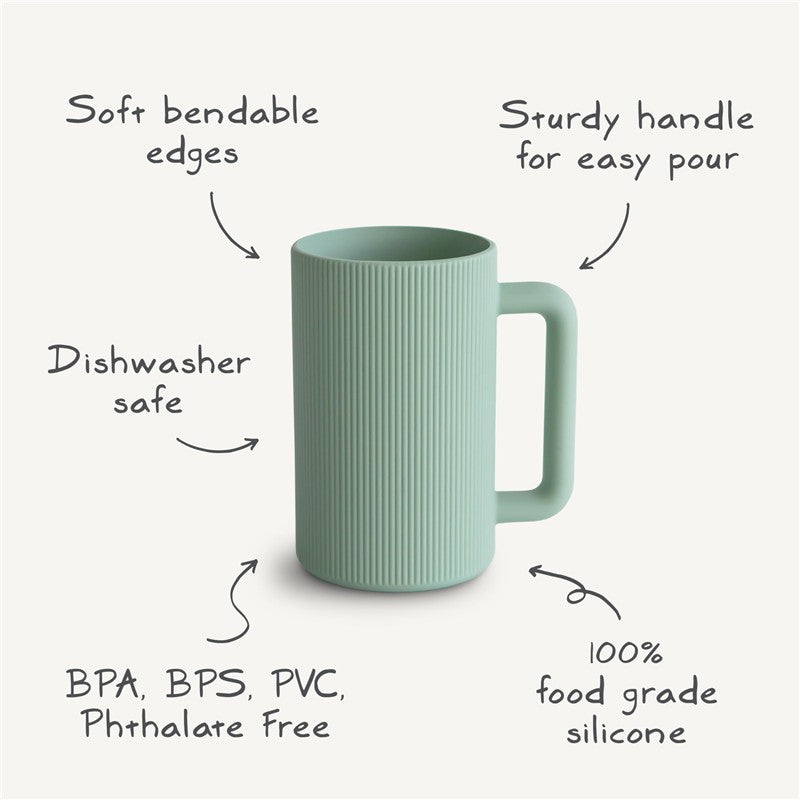Mushie Bath Rinse Cup in natural green silicone with soft bendable edges, sturdy handle, and dishwasher safe features.