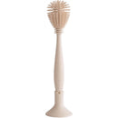 Mushie Silicone Baby Bottle Brush in Shifting Sand color, featuring a soft bristle head and ergonomic handle.