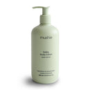 Mushie baby body lotion in green lemon, 400 ml, featuring a pump top and minimalist design.