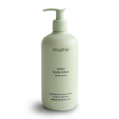 Mushie baby body lotion in green lemon, 400 ml, featuring a pump top and minimalist design.