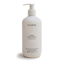 Mushie baby body lotion in a white pump bottle, 13.53 fl oz, fragrance-free, made from naturally derived ingredients.