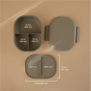 Mushie Bento Lunch Box in sage color, featuring three sections with various capacities labeled in ounces and milliliters.