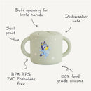 Mushie Bluey X Mushie Snack Cup in sage green, featuring a cartoon character design, with spill-proof, soft opening, and dishwasher safe.