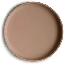 Classic silicone suction plate in a natural color, designed to stay in place during mealtime.