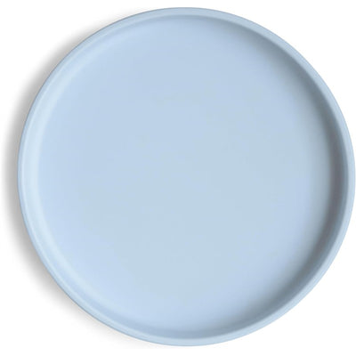 Classic silicone suction plate in powder blue with a smooth surface, designed for young children to prevent spills.