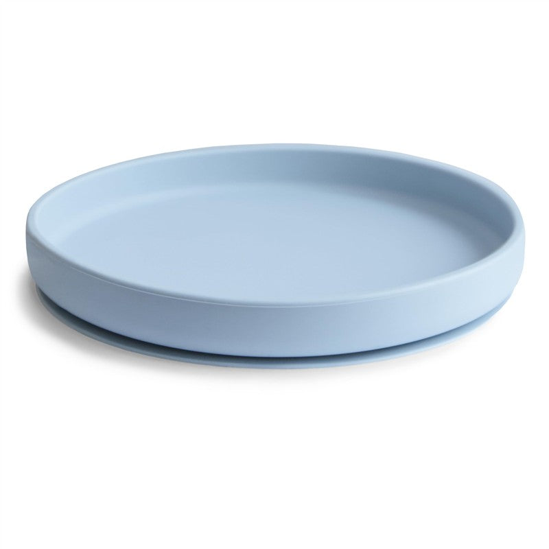 Classic silicone suction plate in powder blue, designed for children, featuring a gentle curved edge for safety.