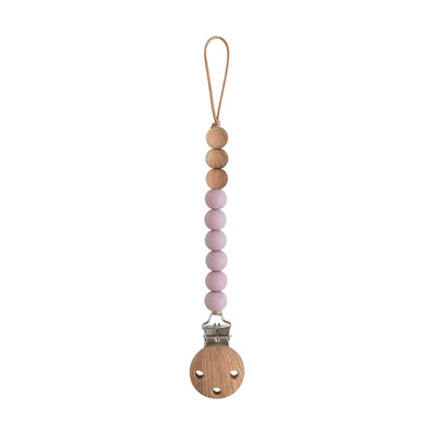 Mushie Eva pacifier clip in mauve featuring wooden beads and a metal clip for securing pacifiers.