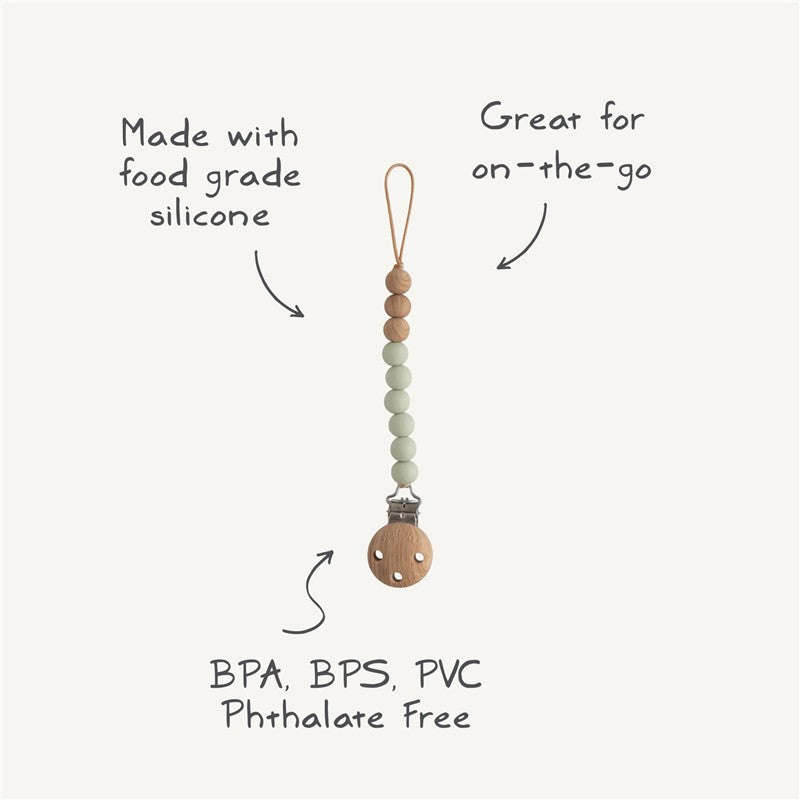 Mushie Eva Pacifier Clip in mauve, made with food-grade silicone, features beads and a wooden clip, labeled BPA, BPS, PVC free.