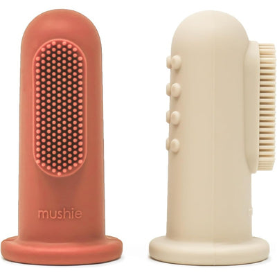 Mushie 2-Pack Finger Toothbrush in Clay and Shifting Sand colors, with textured surfaces for gentle cleaning.