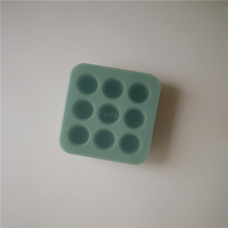 Mushie Fresh Food Feeder Freezer Tray in Cambridge Blue with nine circular compartments for freezing baby food.