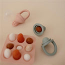 Mushie Fresh Food Feeder Freezer Tray in Cambridge Blue, with silicone feeders and a tray holding colorful food shapes.