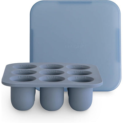 Mushie Fresh Food Feeder Freezer Tray in blue, featuring ten compartments for easy food freezing and storage.