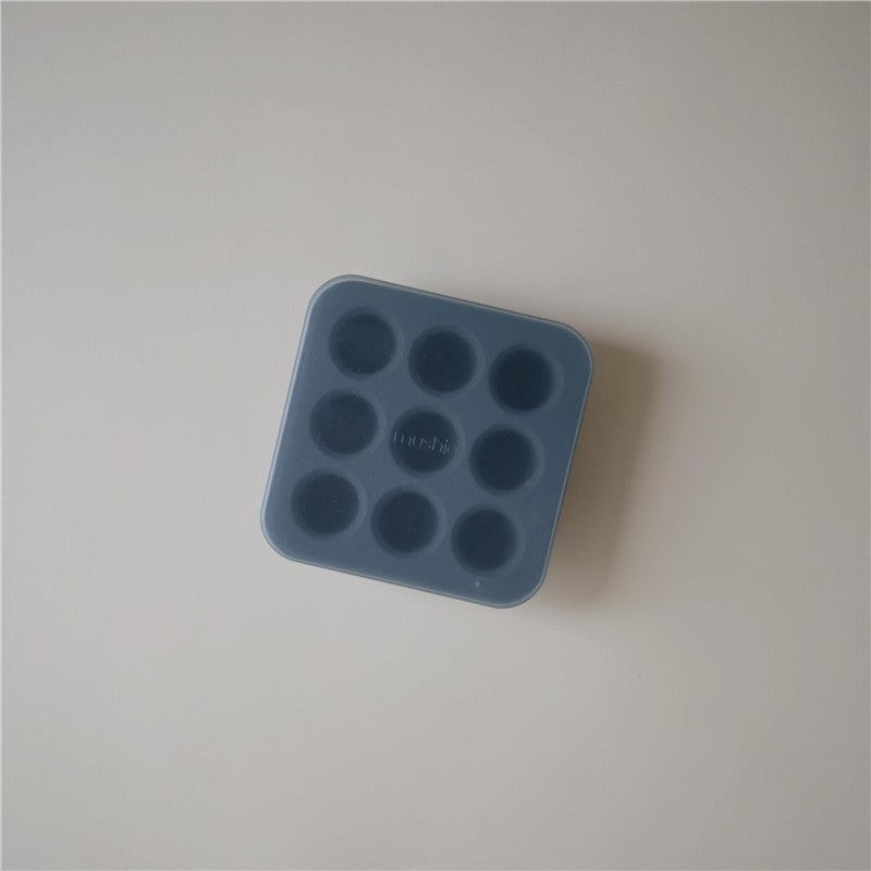 Mushie Fresh Food Feeder Freezer Tray in Tradewinds color, featuring eight round compartments for freezing baby food.