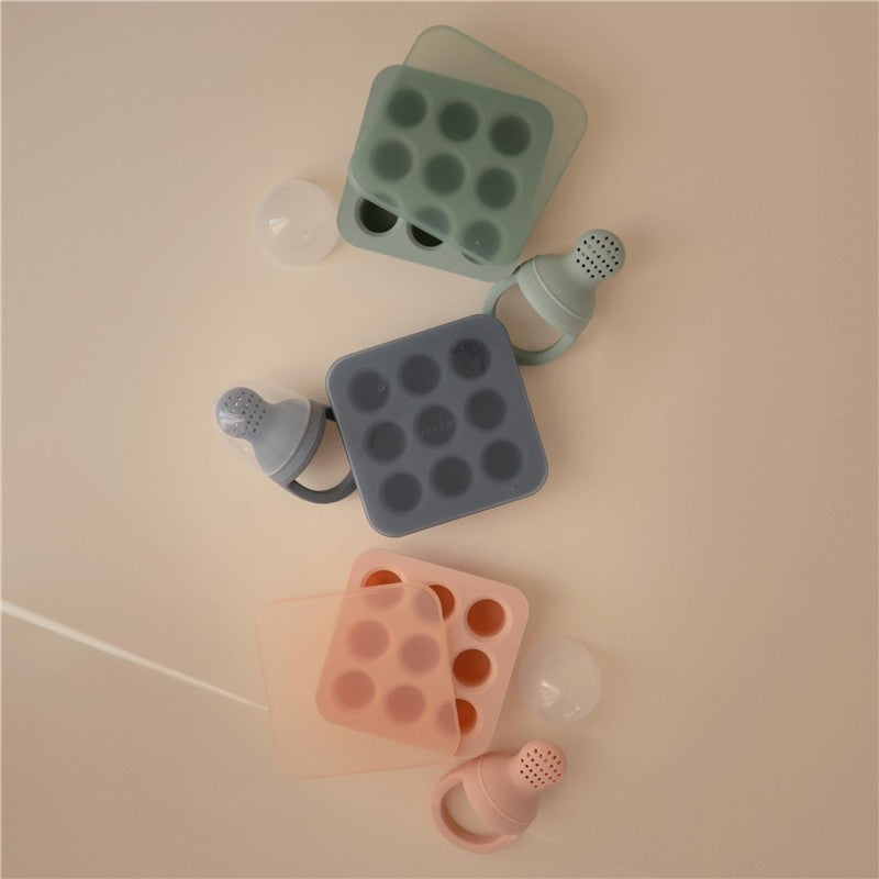 Mushie Fresh Food Feeder Freezer Tray in Tradewinds colors, featuring gray and mint trays with silicone feeding caps.