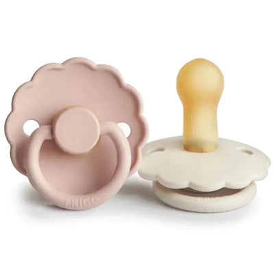 Natural rubber baby pacifier set by Mushie in blush and cream colors, designed for infants 6 to 18 months.