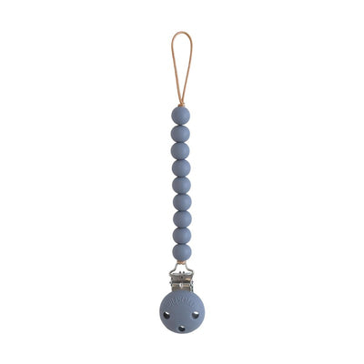Silicone pacifier clip in Tradewinds color, featuring a series of blue beads and a metal clip for securing pacifiers.