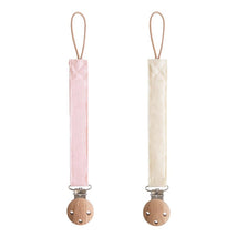 Mushie Linen Pacifier Clip 2-Pack in Blush and Cream, featuring soft fabric straps with wooden clips.