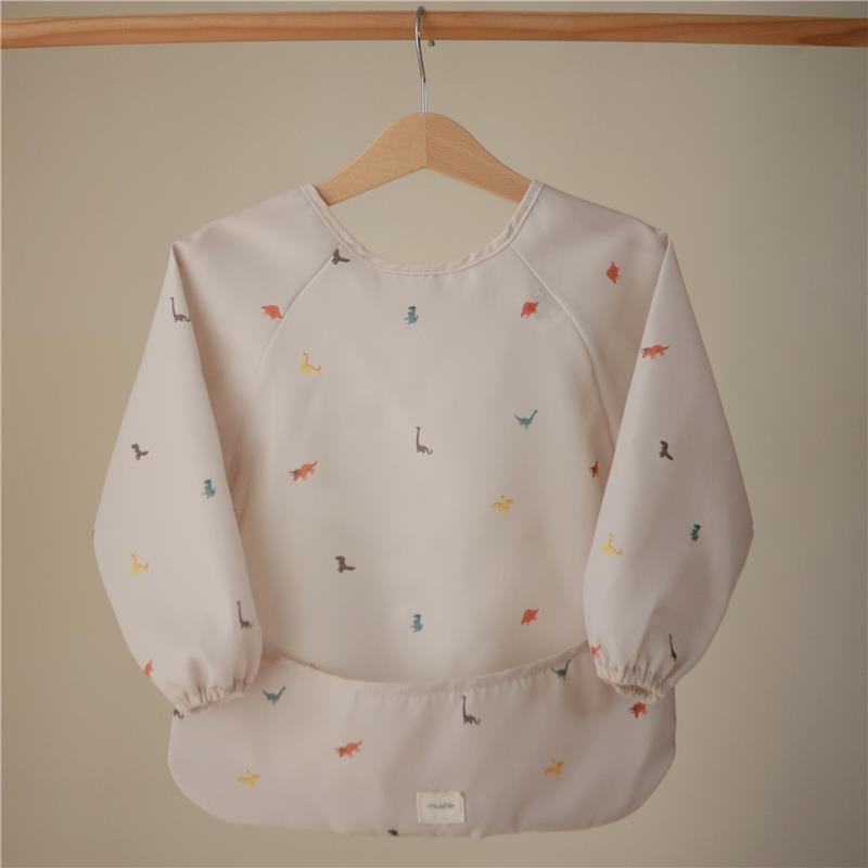 Long sleeve baby bib featuring a water-resistant design with colorful dinosaur patterns, adjustable fit.
