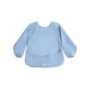 Long sleeve bib in light blue color with elastic cuffs and a large front pocket, ideal for mealtime protection for children.