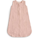 Mushie Muslin Sleep Bag in blush color, featuring a sleeveless design and front zipper for easy dressing.