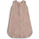 Mushie Muslin Sleep Bag in blush color, featuring a zip closure and a sleeveless design, made from soft, textured fabric.