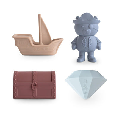 Mushie Pirate Mold Free Bath Play Set featuring a ship, pirate bear, treasure chest, and diamond, all made of soft, colorful material.