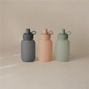 Mushie Puree Pouch in Cambridge Blue, alongside peach and green pouches, featuring a simple design and secure lid.