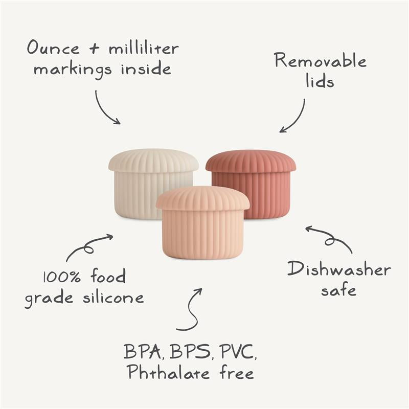 Silicone baby food containers in green, pink, and beige; features ounce/milliliter markings, removable lids, and safety details.