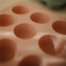 Silicone baby food freezer tray in Cambridge Blue with eight portioned cavities and measurement markings for easy use.