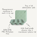 Mushie Baby Food Freezer Tray in Cambridge Blue, featuring nine 1.5 oz cups with measurement markings and a translucent lid.