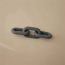 Silicone baby teether toy in a chain link design, colored grey, against a neutral background.