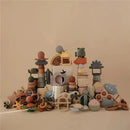 Multicolored silicone baby teethers and toys arranged artistically, showcasing various shapes and textures.