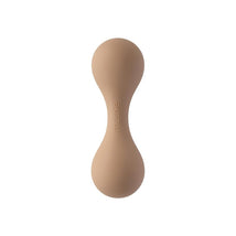 Mushie silicone baby rattle toy in a natural color, designed for babies to grasp and play with.