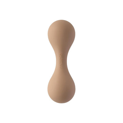 Mushie silicone baby rattle toy in a natural color, designed for babies to grasp and play with.