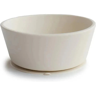 Silicone baby suction bowl in ivory, designed to securely adhere to surfaces during mealtime.