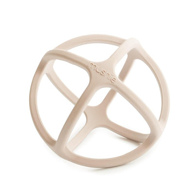 Mushie silicone ball teether in shifting sand color, featuring a soft, rounded shape and grippable design for infants.