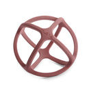 Mushie Silicone Ball Teether in a soft pink color with a multi-dimensional design, suitable for infants to chew and play with.