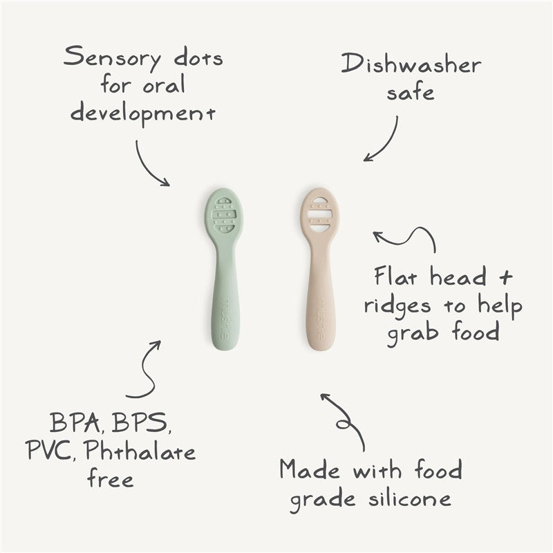 Mushie Silicone First Feeding Baby Spoons in Cambridge Blue and Shifting Sand, featuring sensory dots, dishwasher safe, made of food-grade silicone.