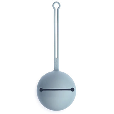 Silicone pacifier holder case in powder blue, featuring a round design with a hanging loop and a slot for secure closure.