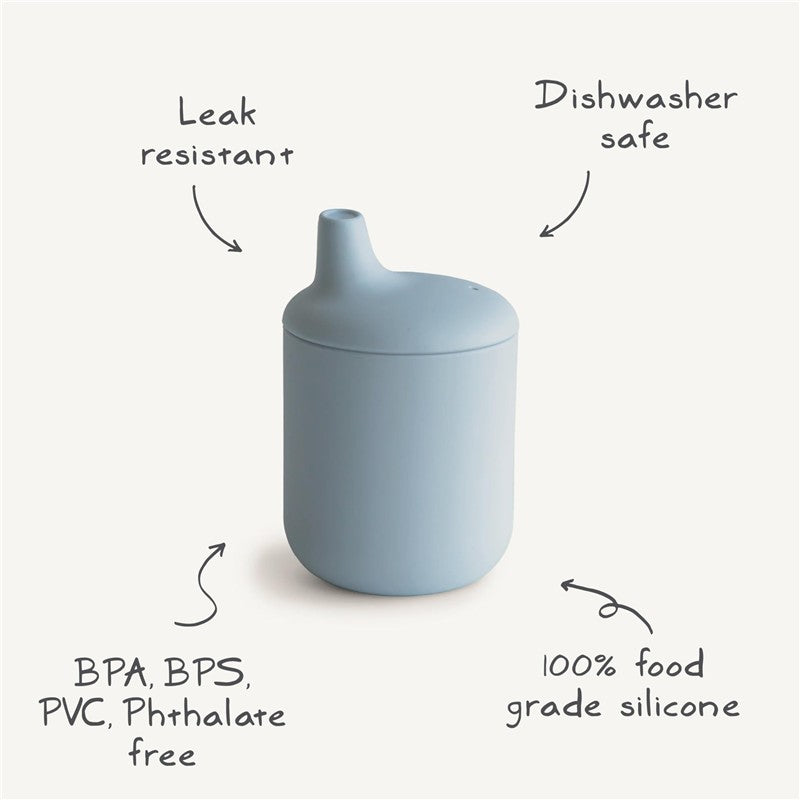 Silicone sippy cup in blush color, featuring leak resistance and dishwasher safety; made from 100% food-grade silicone.