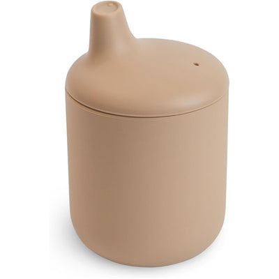 Mushie Silicone Sippy Cup in a natural beige color, featuring a rounded design and a spout for easy drinking.