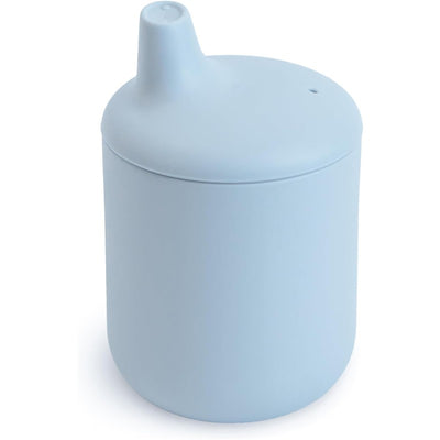 Mushie Silicone Sippy Cup in powder blue, featuring a soft, rounded design with a spout for easy drinking.